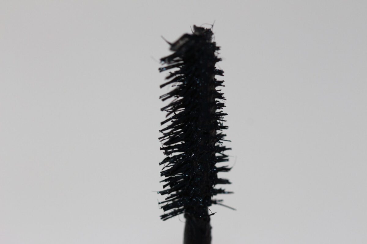 close look at mascara brush with fibers from the side of brush