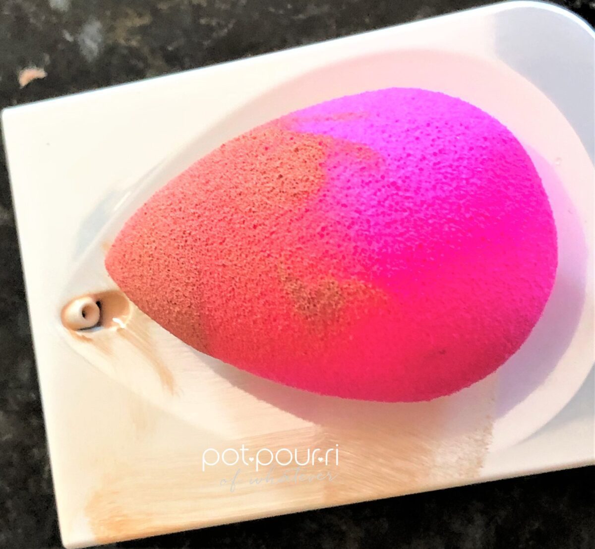 BEAUTY BLENDER PICKING UP FOUNDATION IN THE WELL