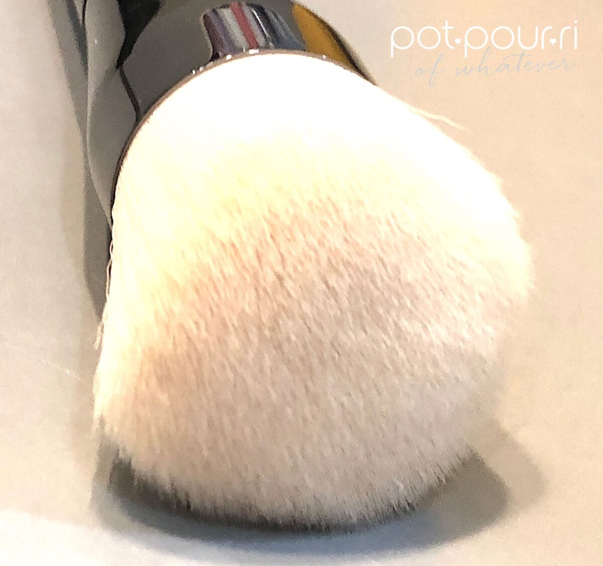 USE THE FLUFFY BRUSH TO BLEND TANTOUR INTO YOUR SKIN